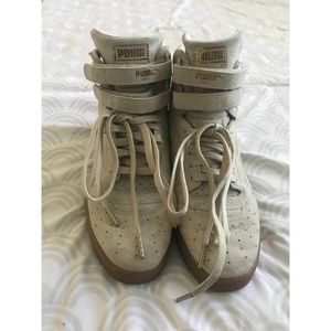 Tan PUMA high tops